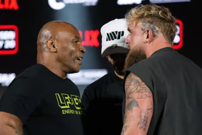 A promotional image of Mike Tyson and Jake Paul facing off, with a superimposed 