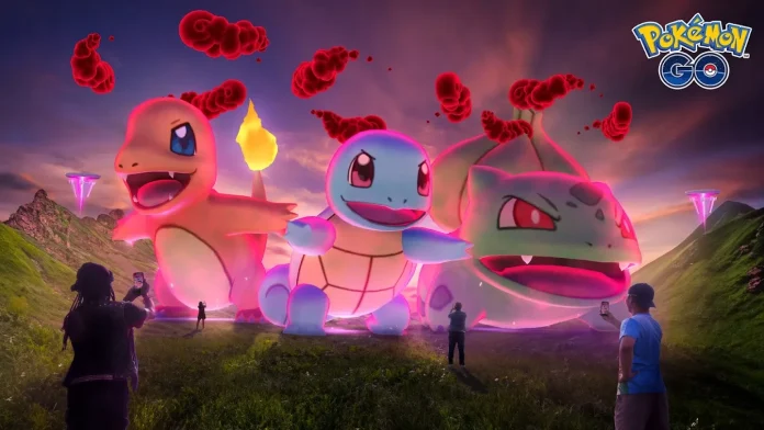 January 2025’s Max Mondays in Pokémon GO features players engaging in augmented reality battles against giant, illuminated versions of Charizard, Squirtle, and Bulbasaur in a lush, mountainous landscape at sunset.