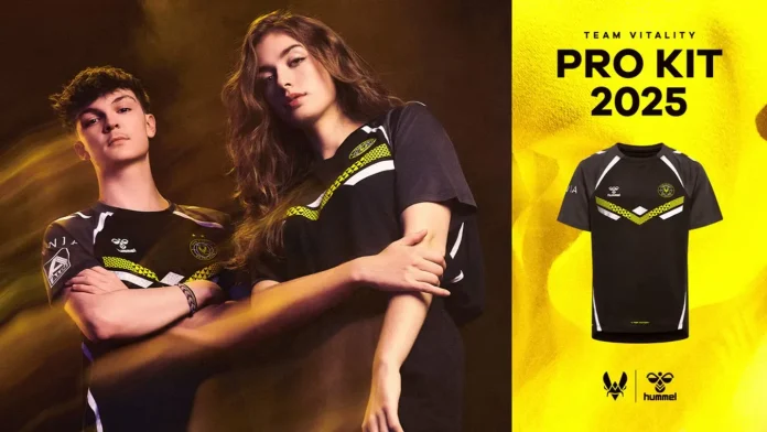 Promotional image for Team Vitality's Pro Kit 2025, featuring a male and female esports player in the new black and yellow jerseys. The image highlights the jerseys' sleek design with geometric patterns and the Team Vitality logo, set against a dynamic yellow background.