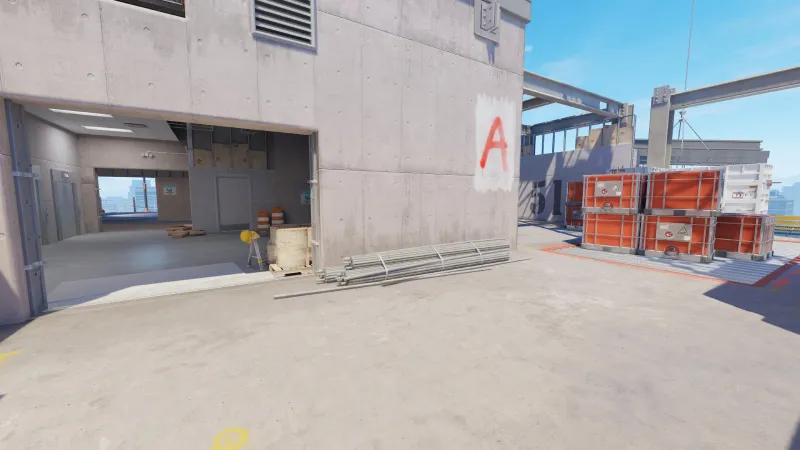 Overhead view of the revamped Vertigo bombsite A in CS2, showcasing the new catwalk and door.